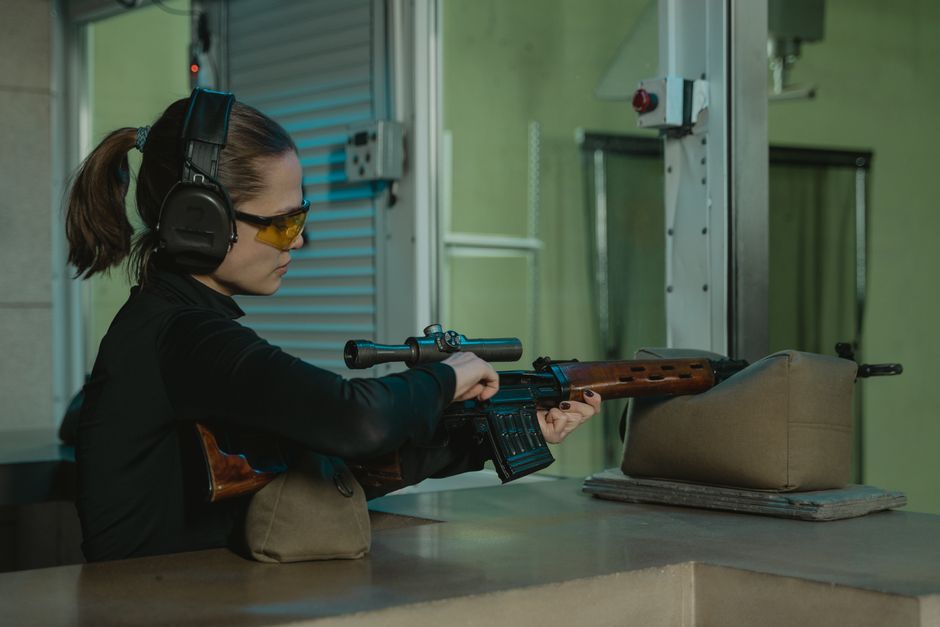 Professional indoor gun range facility with shooting booths and safety equipment