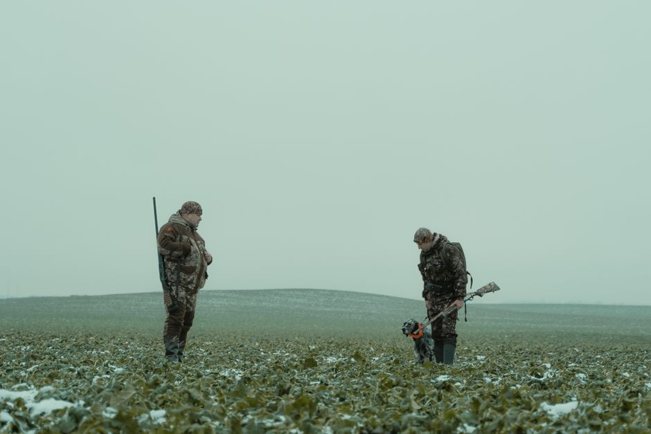 Hunter in outdoor natural landscape exploring wilderness for hunting