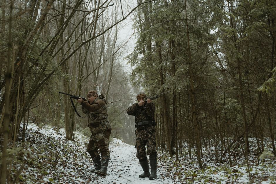 Outdoor hunting scene in wilderness forest landscape with natural environment