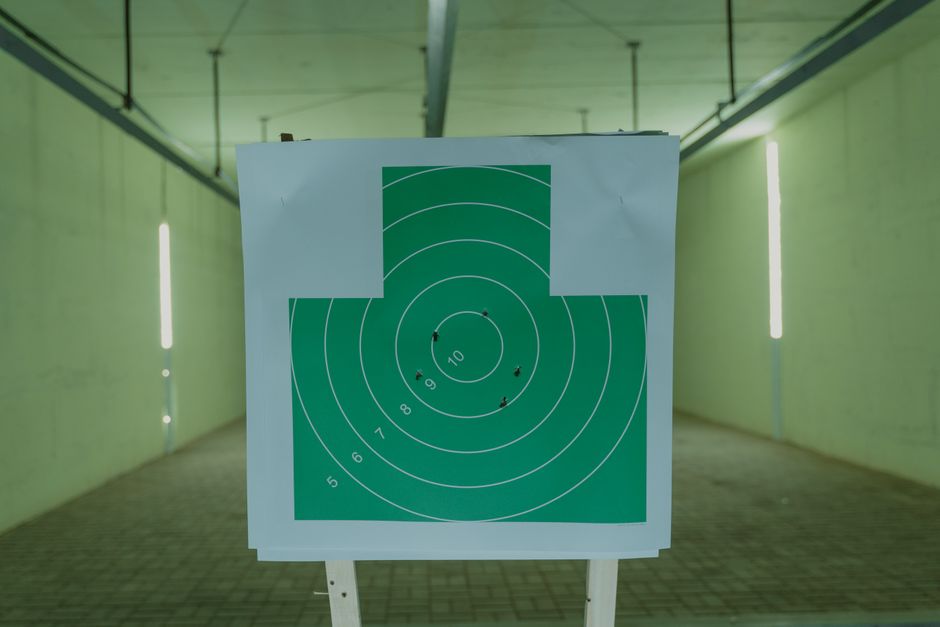 Rifle target shooting practice at a supervised range emphasizing safety and discipline