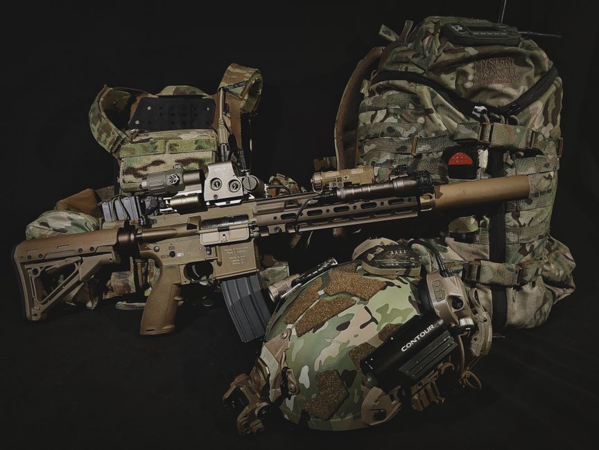 Tactical firearms gear and equipment display showing professional sporting accessories